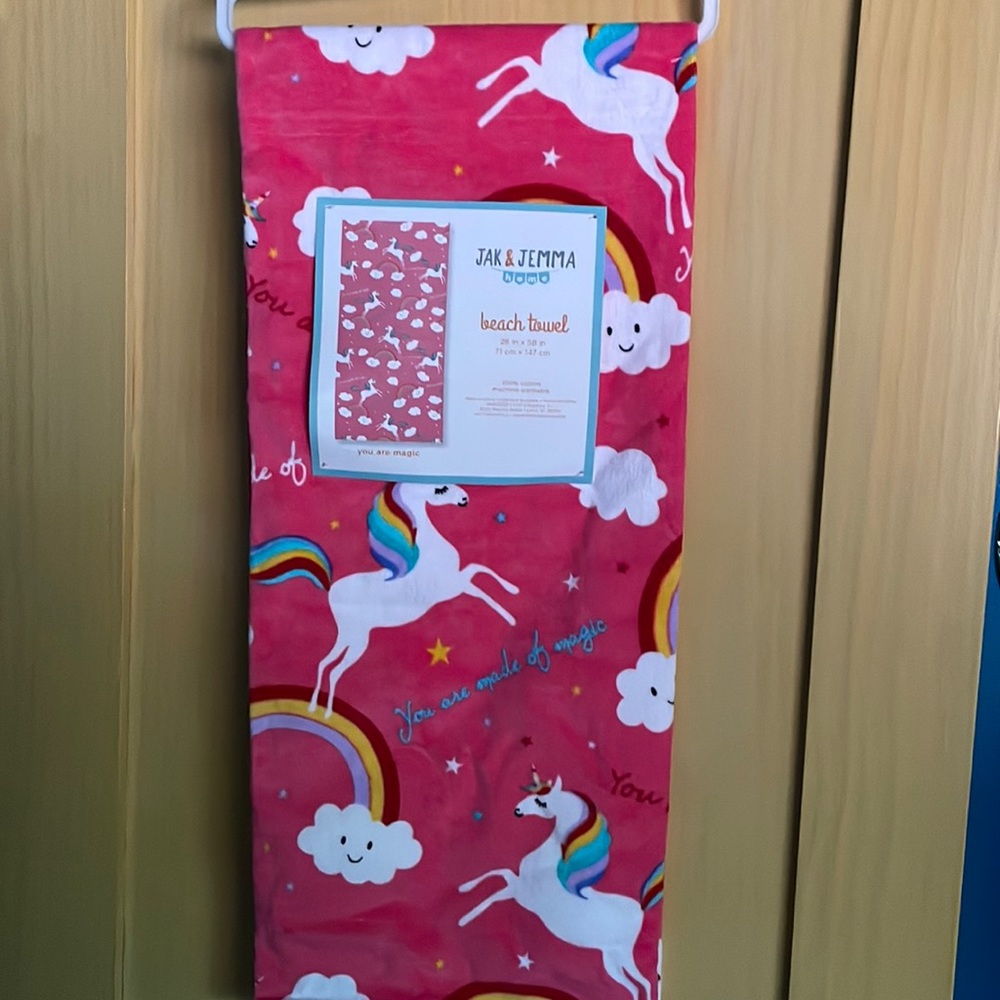 Pink magical unicorn beach towel